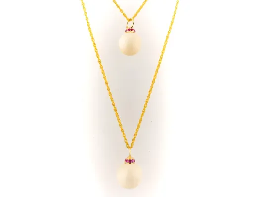 Ivory Jacks Fossilized Woolly Mammoth Ivory Tear Drop Pendant With Pink Sapphires