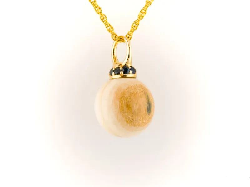 Ivory Jacks Fossilized Woolly Mammoth Ivory Tear Drop Pendant With Blue Sapphires