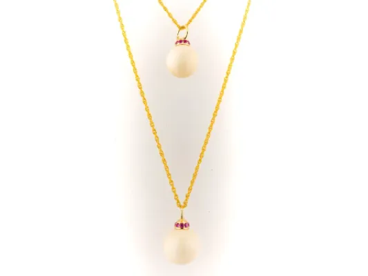 Ivory Jacks Fossilized Woolly Mammoth Ivory Tear Drop Pendant With Pink Sapphires