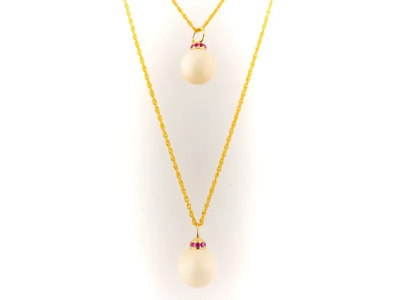 Ivory Jacks Fossilized Woolly Mammoth Ivory Tear Drop Pendant With Pink Sapphires