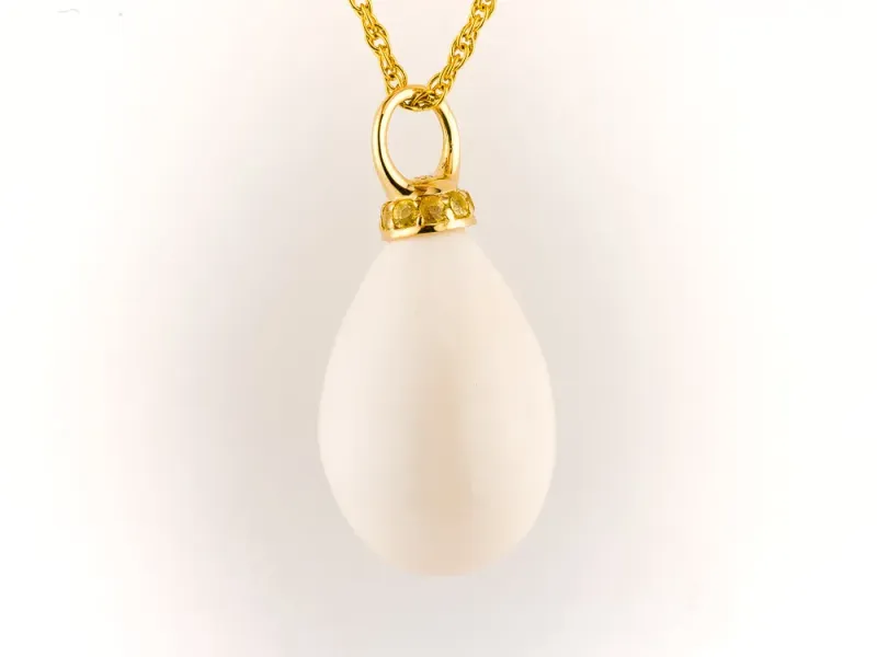 Ivory Jacks Fossilized Woolly Mammoth Ivory Tear Drop Pendant With Yellow Sapphires