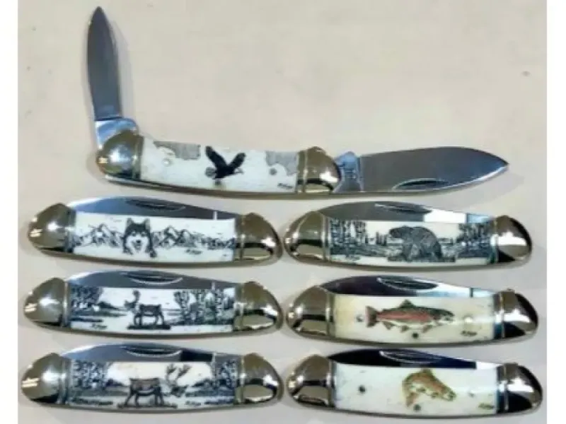 SCRIMSHAW ANTLER HANDLE WITH DOUBLE BLADE KNIFE.