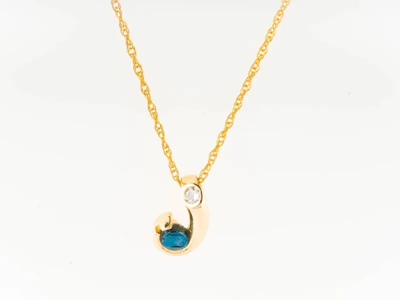 Star Of Alaska Curved Fish Hook Covellite Pendant With Single Diamond