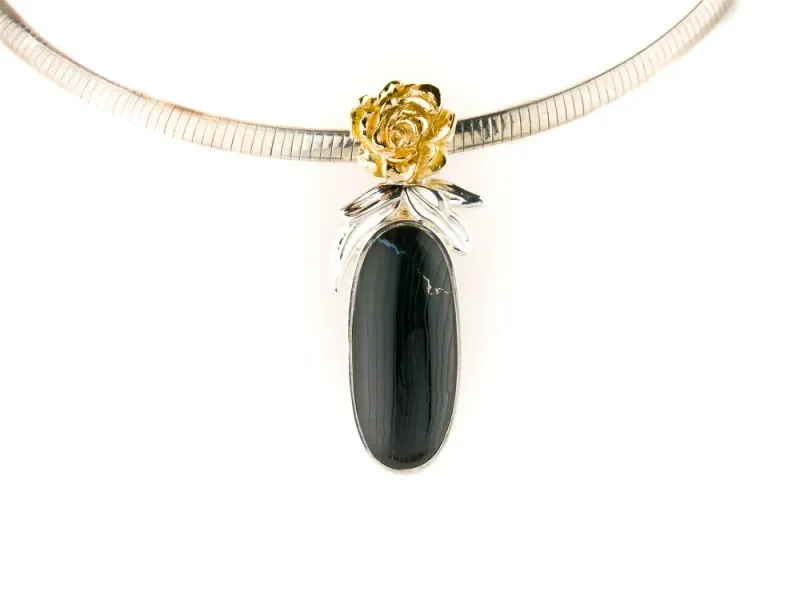 Alaska Black Petrified Wood Oval Shaped Pendant With 14 Karat Rose Engraving